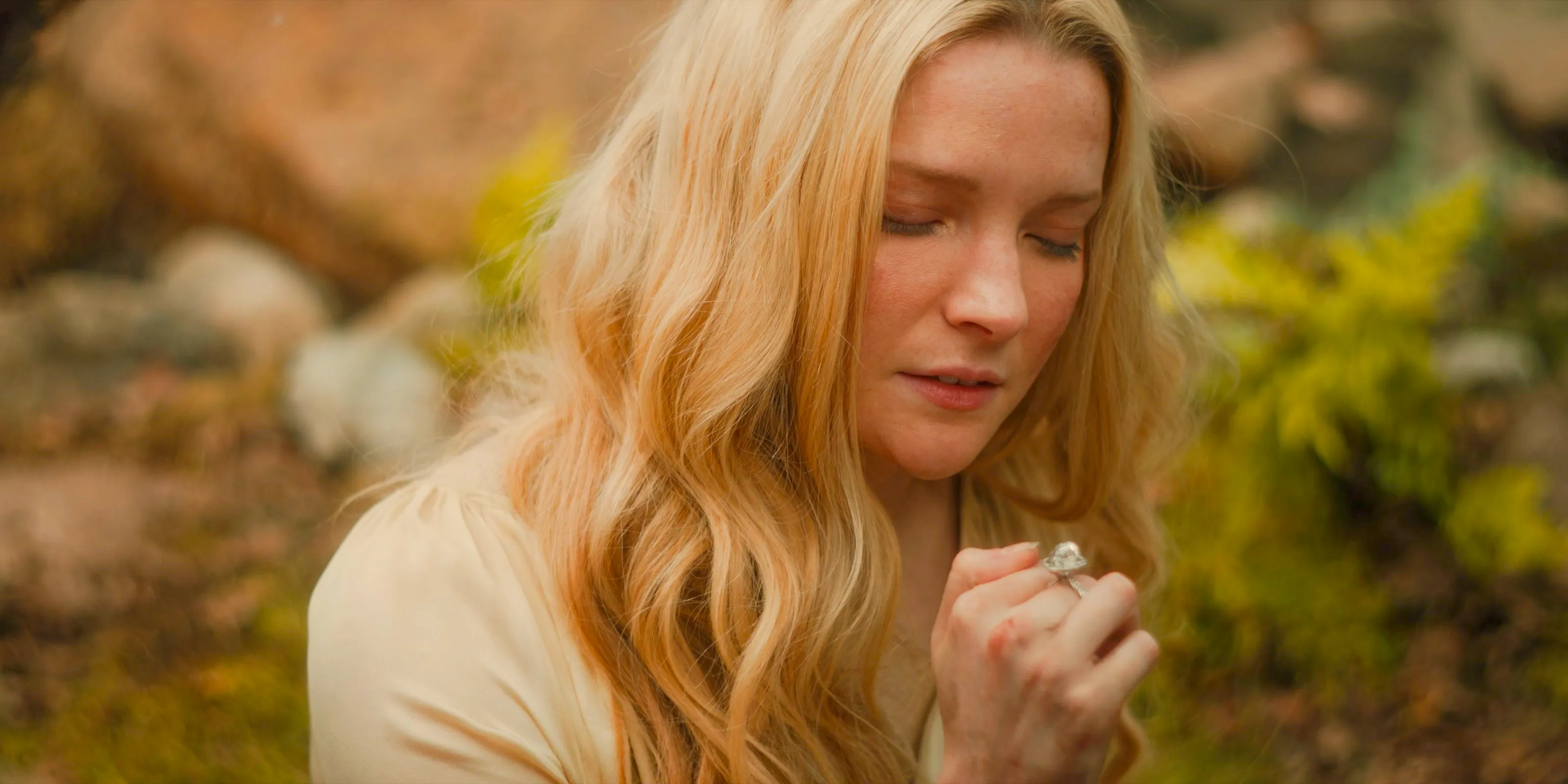 Galadriel (Morfydd Clark) retrieves her Ring of Power in The Lord of the Rings: The Rings of Power Season 2 Episode 8 Image