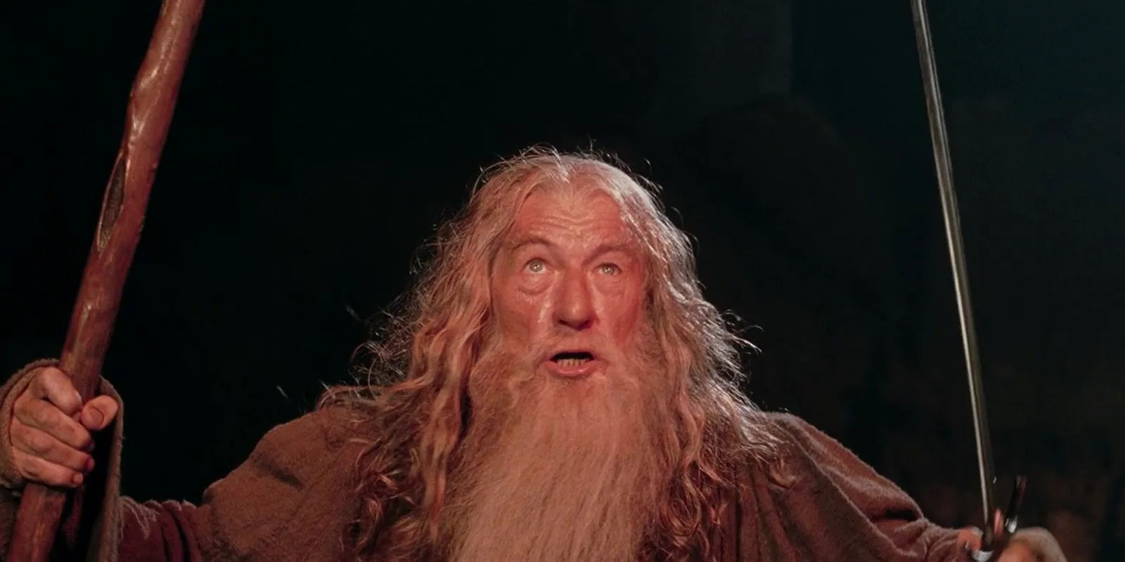 Gandalf holding his sword and staff, fighting the Balrog, in Lord of the Rings: The Two Towers. Image