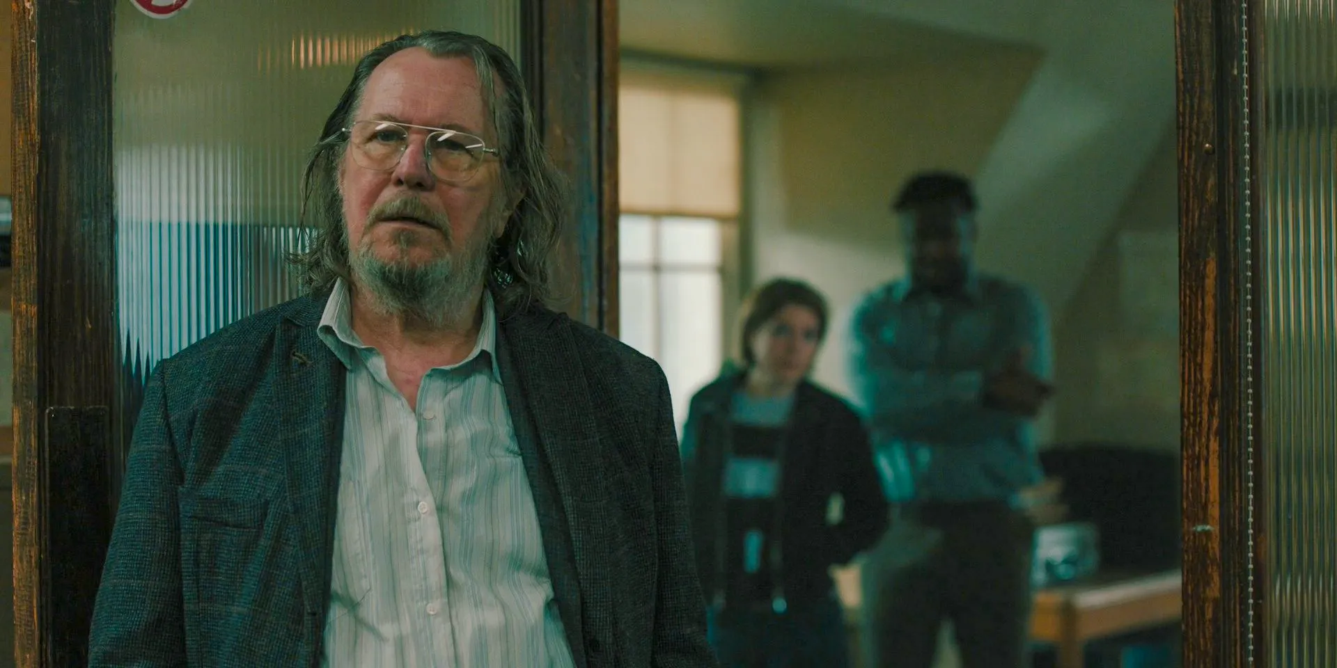 Gary Oldman standing in Slough House as Jackson Lamb in Slow Horses season 4 Image