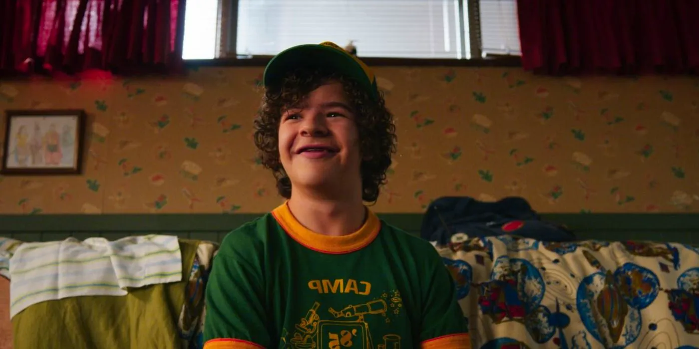 Gaten Matarazzo as Dustin Henderson smiling in Season 3 of Stranger Things Image