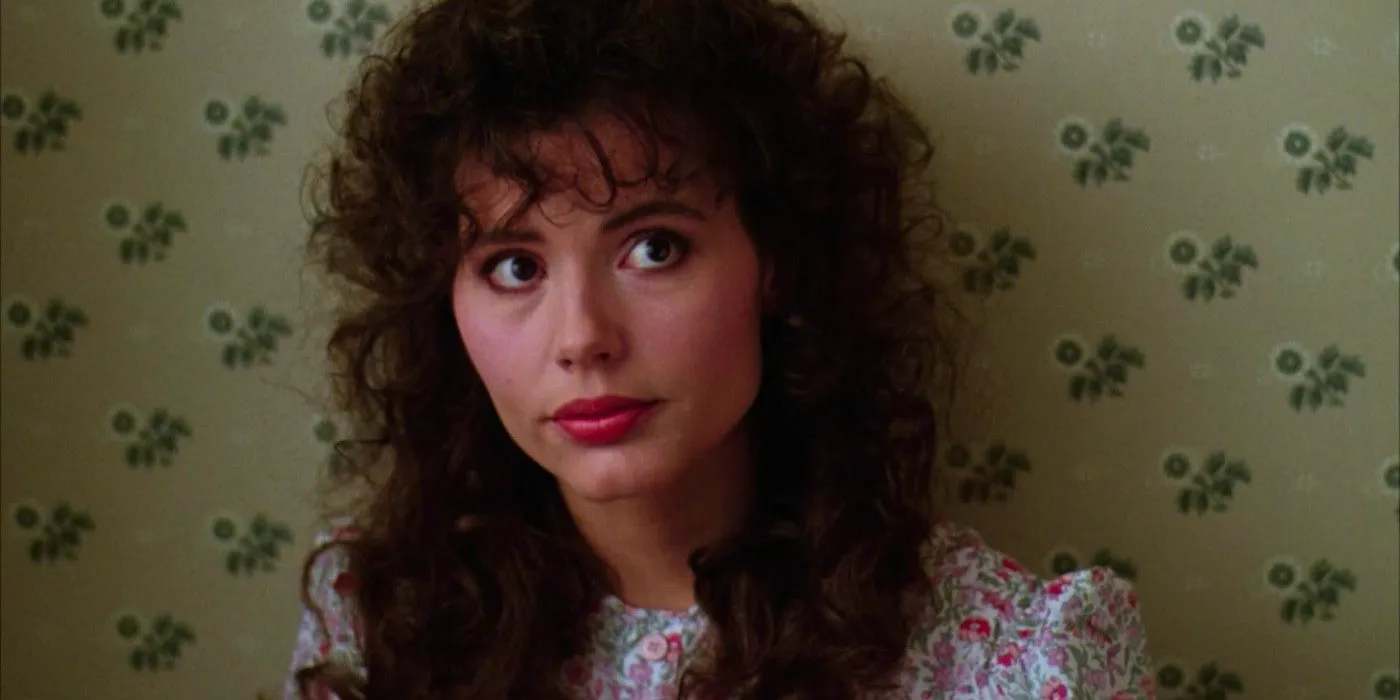 Geena Davis as Barbara standing against wallpaper in Beetlejuice Image