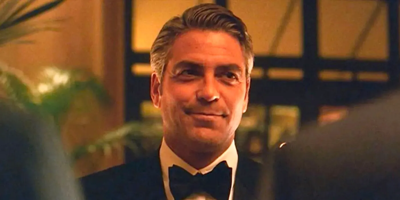 George Clooney smirking in Ocean's Eleven. Image