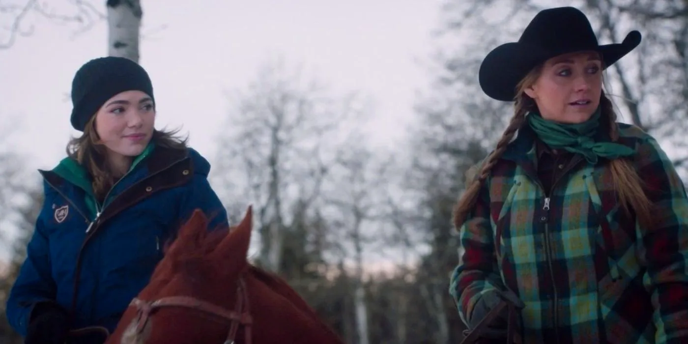 Georgie (Alisha Newton) and Amy (Amber Marshall) ride horses in the snow in Heartland  Image