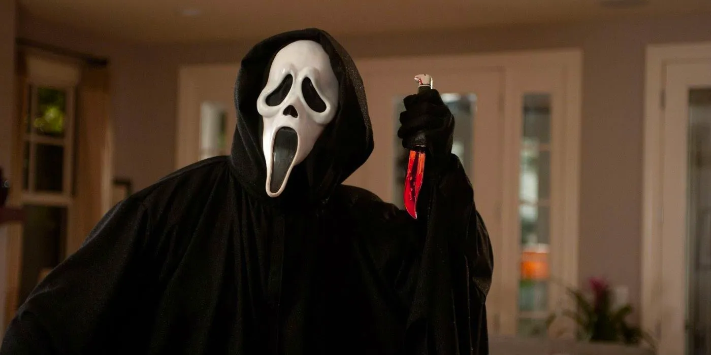 Ghostface holding a bloody knife in Scream Image