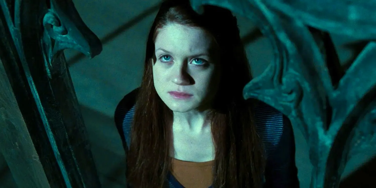 Ginny Weasley (Bonnie Wright) looking up at the sky scared in Harry Potter and the Deathly Hallows Part 2 Image