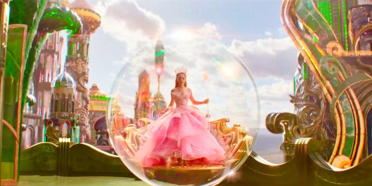 Glinda (Ariana Grande) in a pink dress inside a bubble in Wicked. Image