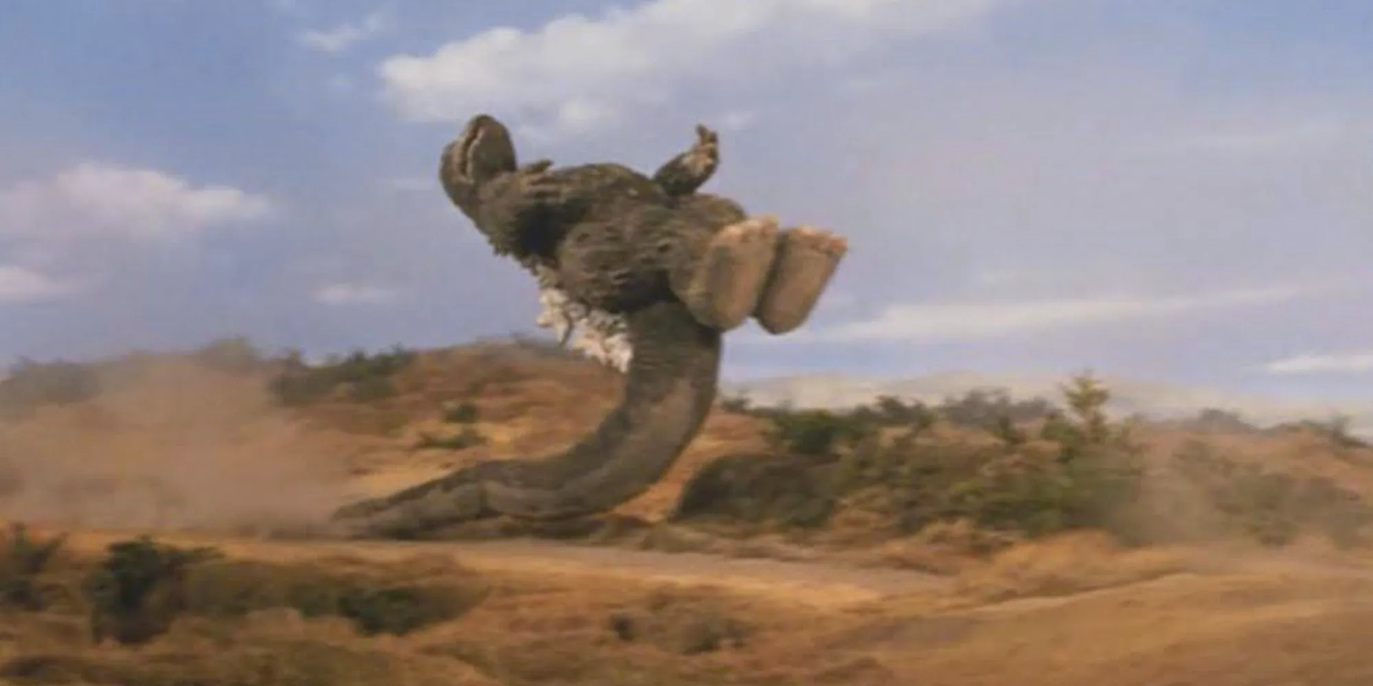 Godzilla does a dropkick move in Godzilla vs Megalon Image