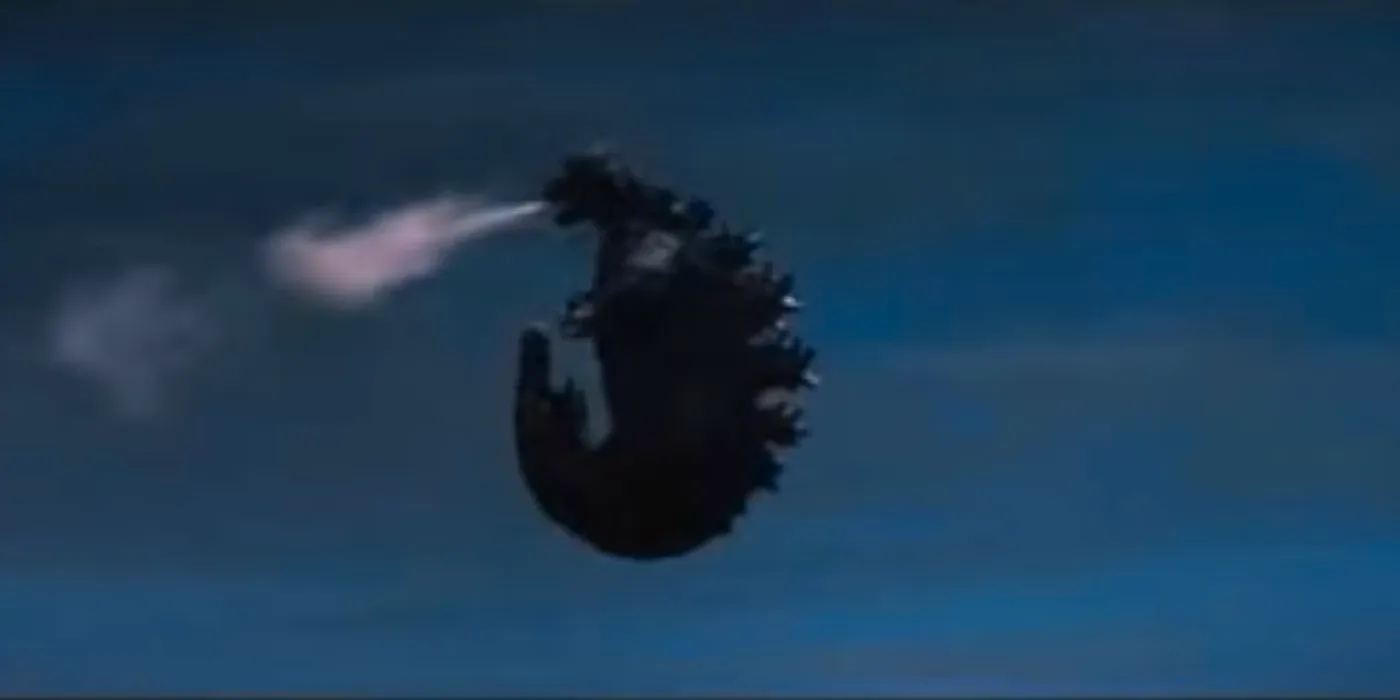 Godzilla flying through the air. Image