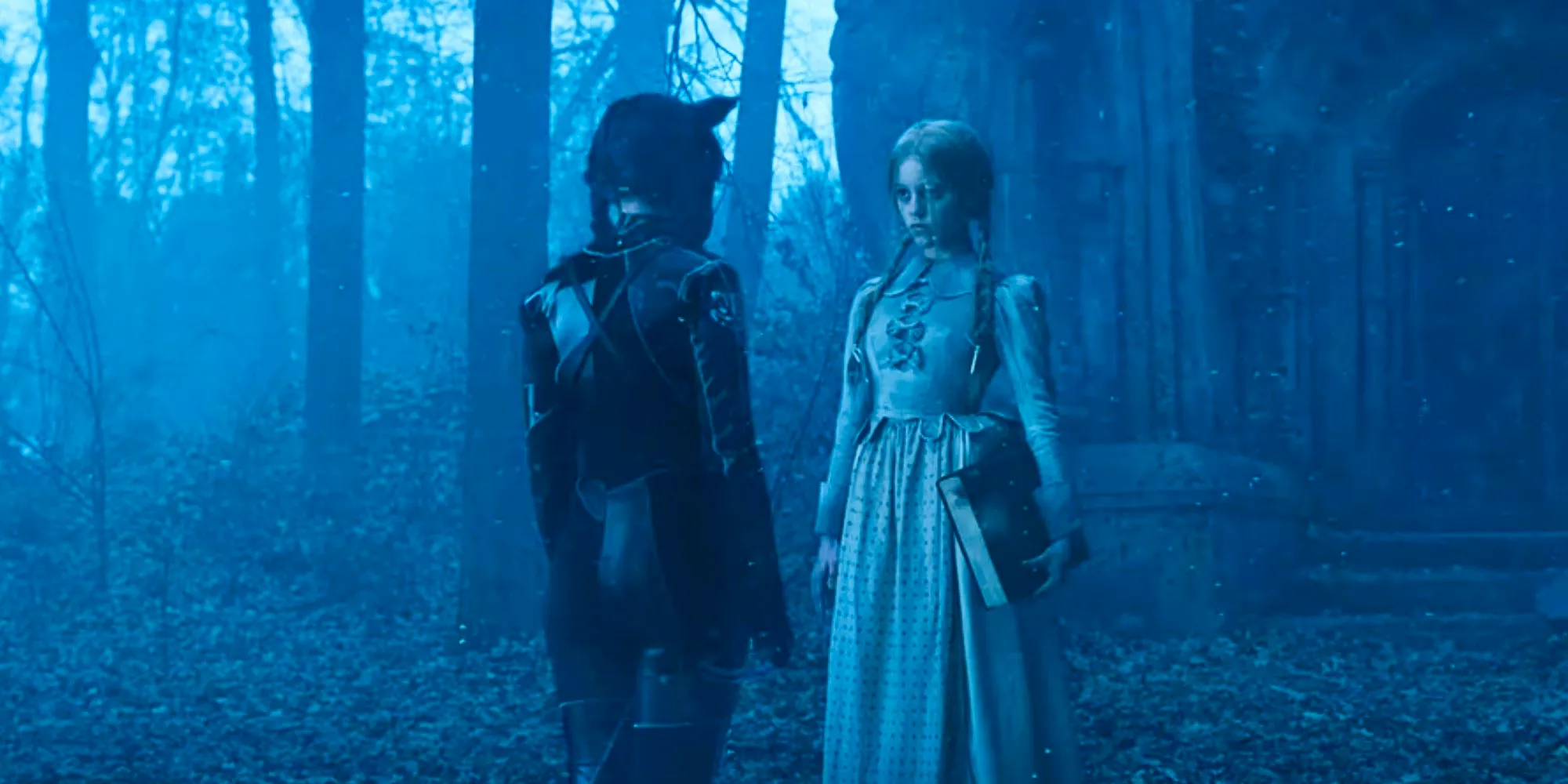 Goody and Wednesday Addams facing each other in the forest in Wednesday Season 1  Image