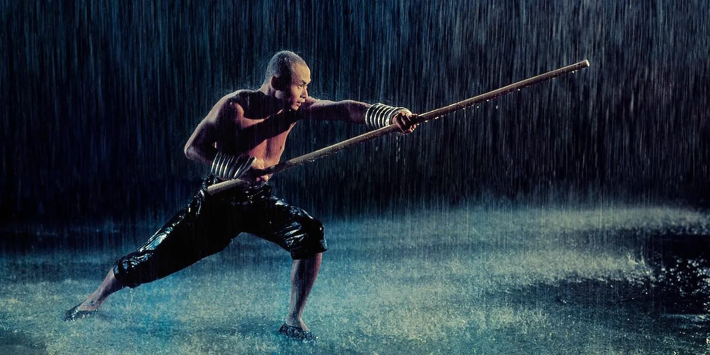 Gordon Liu as Monk San Te trains in the rain in The 36th Chamber of Shaolin. Image