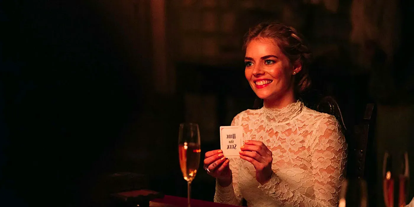 Grace holds up a card that says Hide and Seek in Ready or Not Image