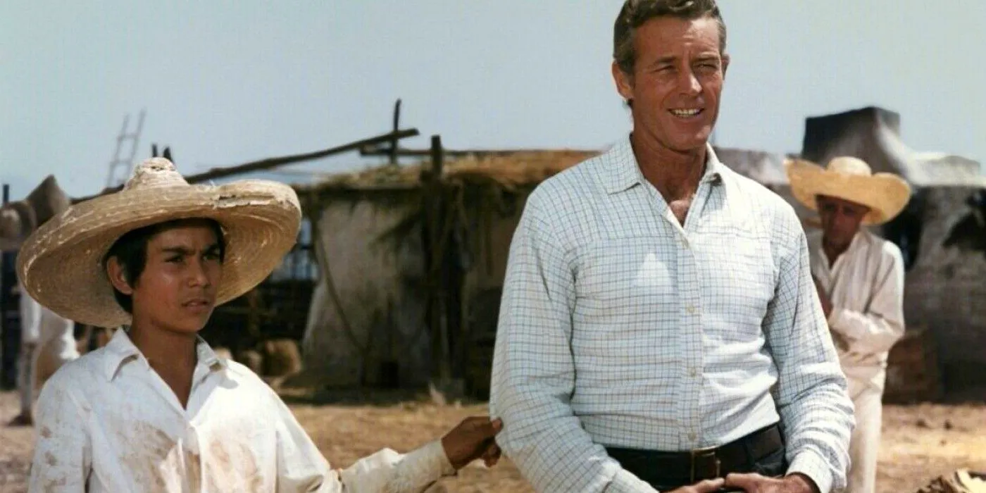 Guy Madison as Wyatt Earp smiling next to a young boy in Duel at Rio Bravo Image