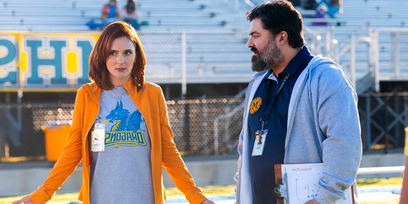 Gwen and Markie stand on the football field while arguing in English Teacher Image