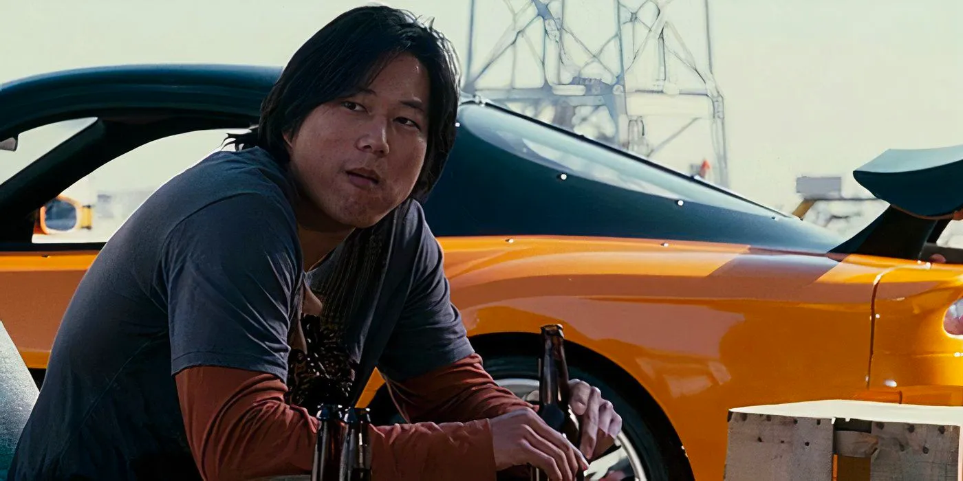 Han sitting by his drift car in the Fast and Furious movie Tokyo Drift.  Image