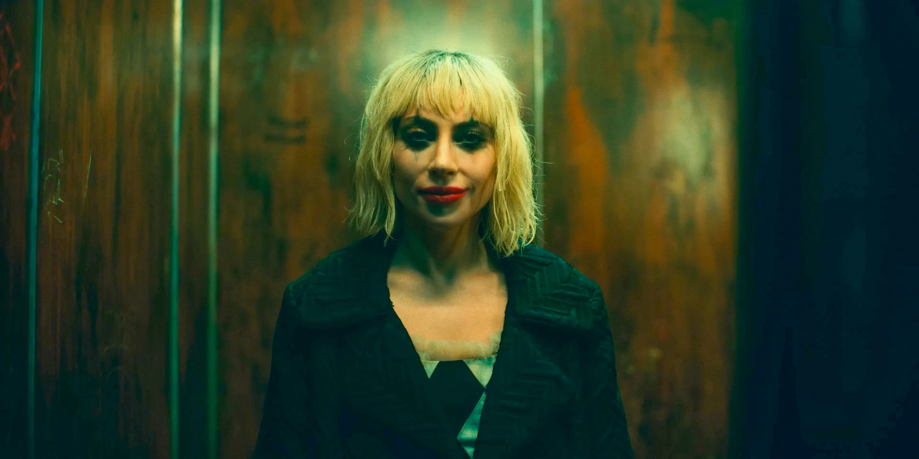 Harley Quinn (Lady Gaga) with disheveled jester makeup in Joker: Folie à Deux Image