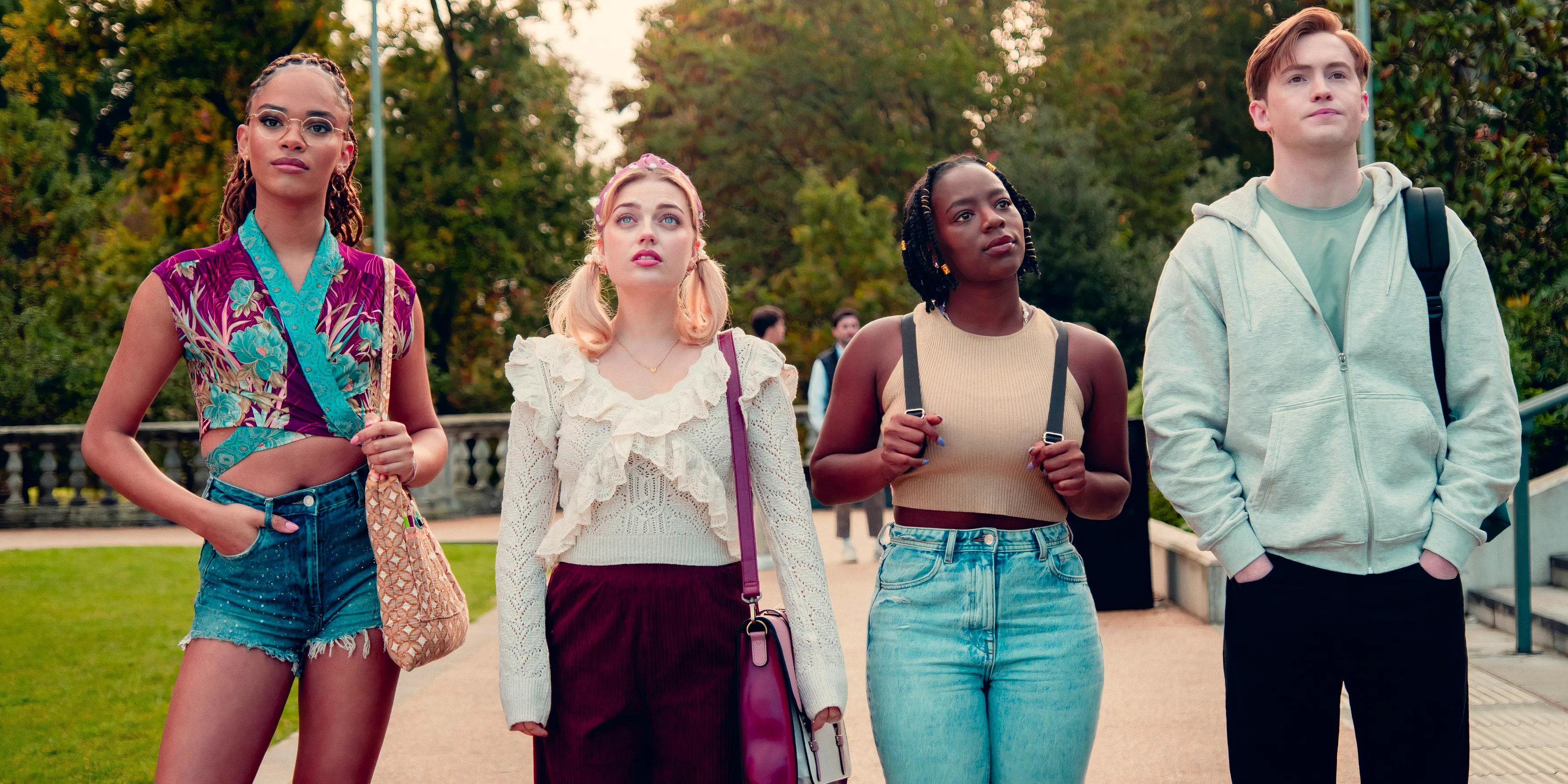 Heartstopper's Nick (Kit Connor), Tara (Corrina Brown), Imogen (Rhea Norwood), and Elle (Yasmin Finney) stand in the middle of a sidewalk in season 3 Image