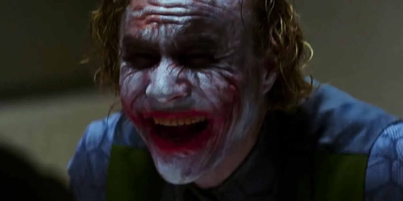 Heath Ledger's Joker laughing hysterically in The Dark Knight Image