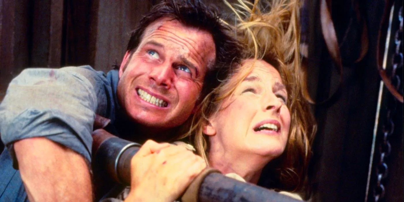 Helen Hunt and Bill Paxton clutching each other in panic as Jo and Bill Harding in Twister Image