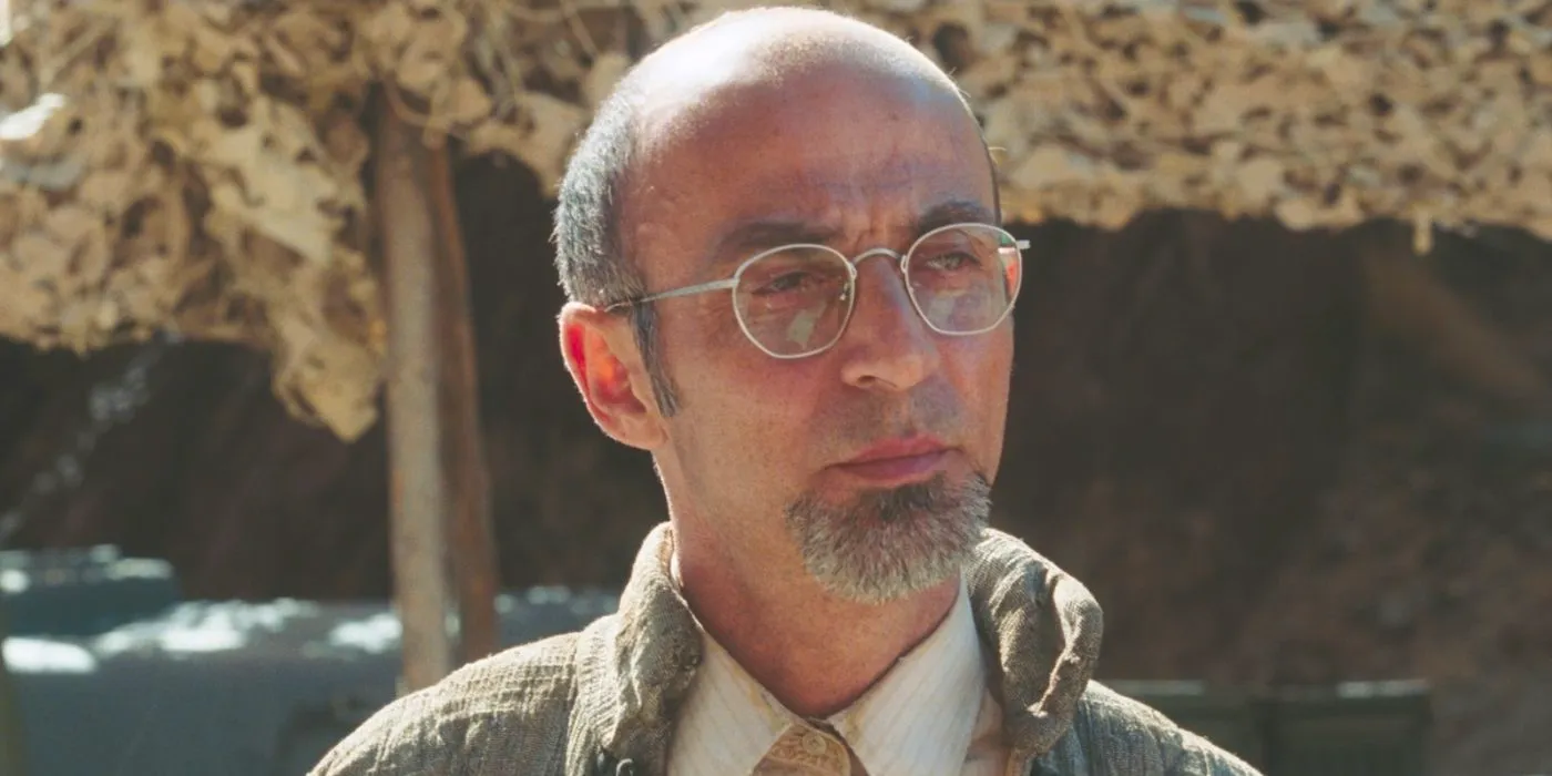 Ho-Yinsen looking at something in the distance in Iron Man Image