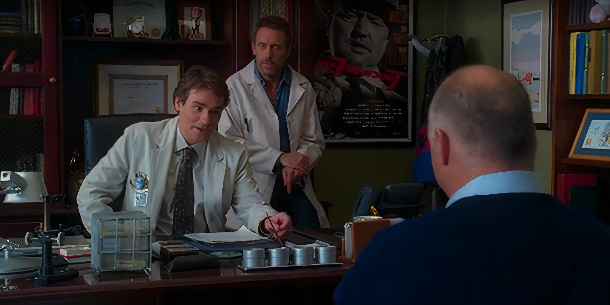 Hugh Laurie as Gregory House and Robert Sean Leonard as James Wilson talking to Wilson's misdiagnosed patient in the House episode Games. Image