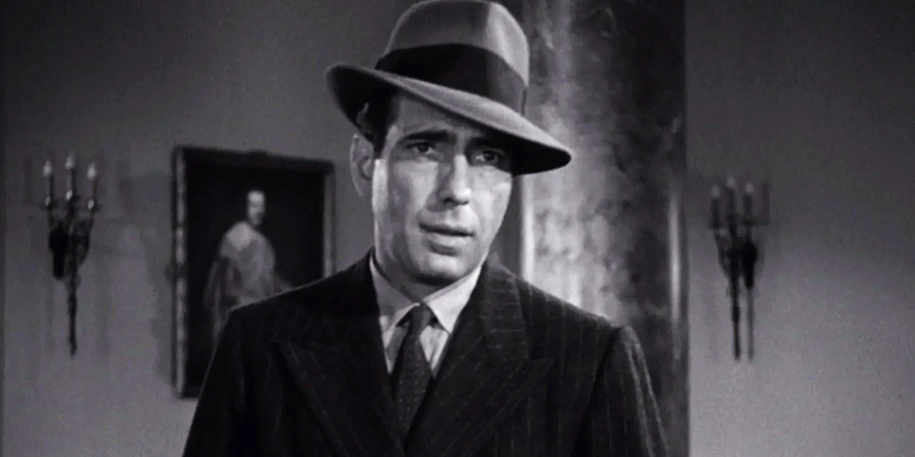 Humphrey Bogart as Sam Spade looking suspicious in The Maltese Falcon Image