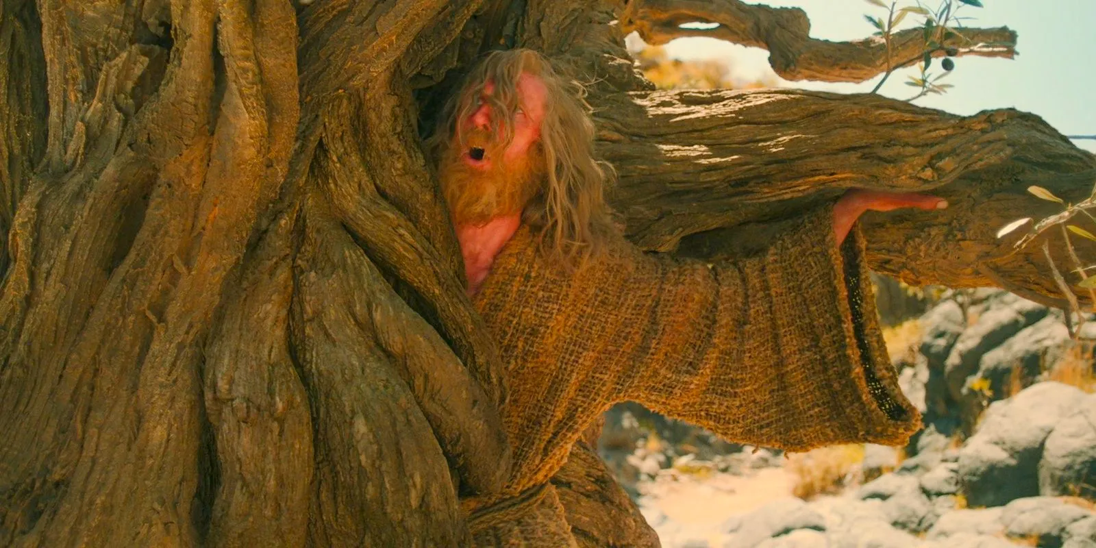 In Rhun, the Stranger (Daniel Weyman) being devoured by Old Man Ironwood in The Lord of the Rings: The Rings of Power. Image