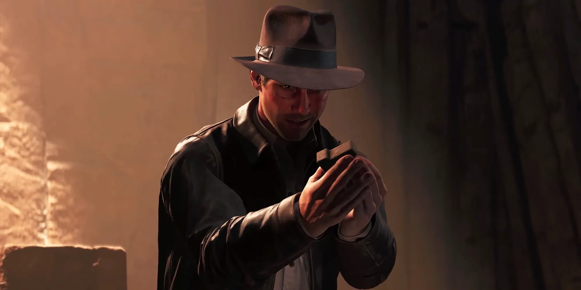 Indiana Jones holds a relic with a smug smile in the Indiana Jones and the Great Circle game Image