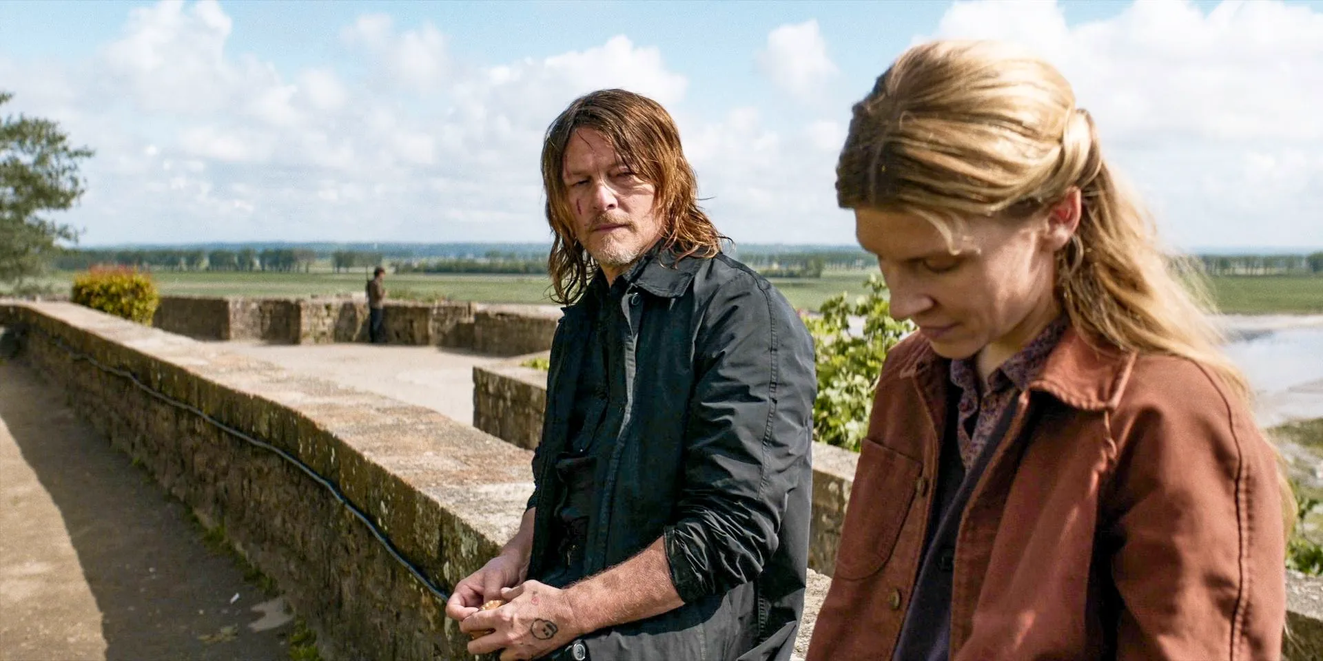 Isabelle (Clémence Poésy) looking away from Daryl (Norman Reedus) in The Walking Dead: Daryl Dixon Season 2 Episode 2 Image