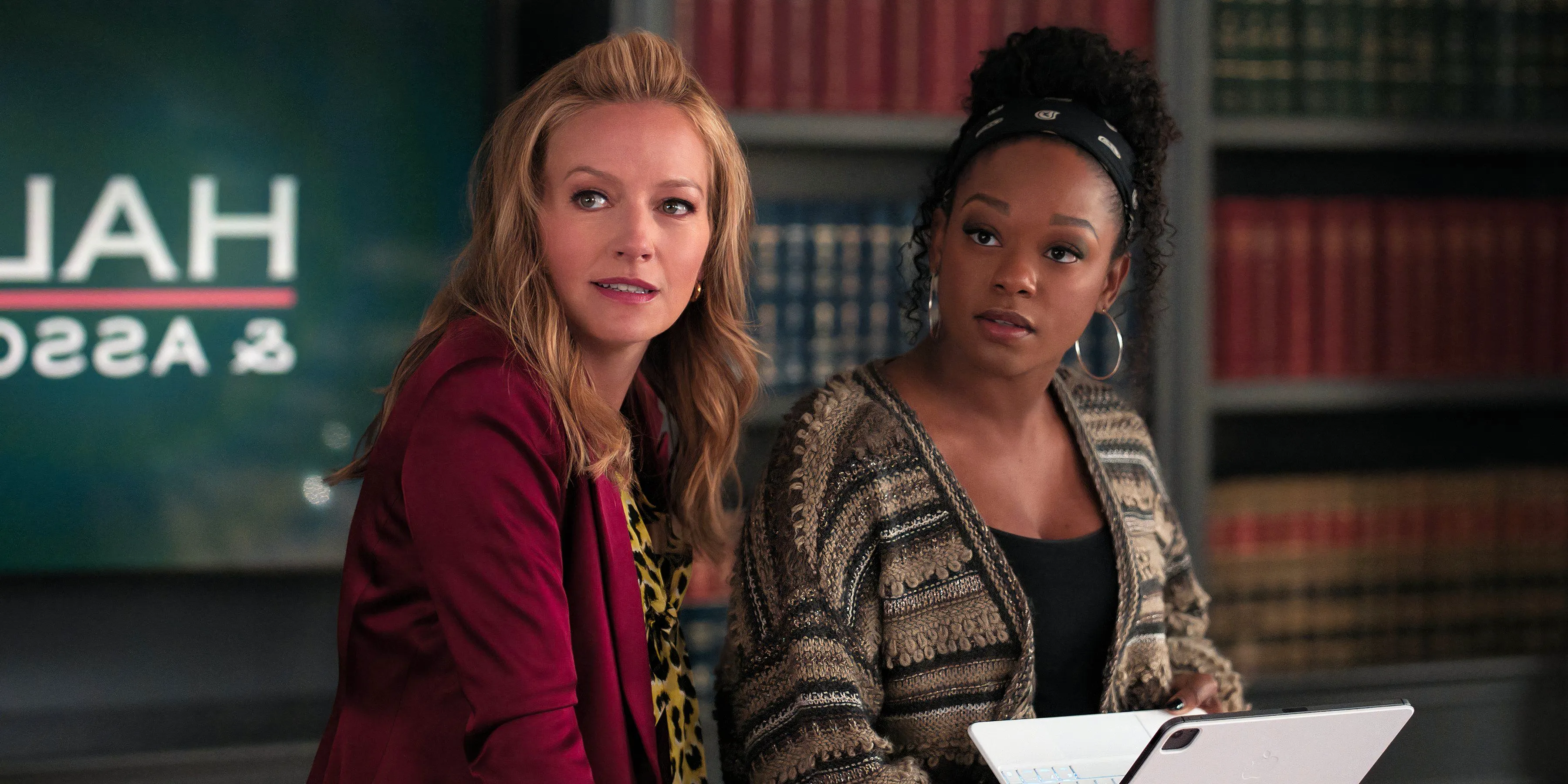 Izzy and Lorna look to the side in The Lincoln Lawyer season 3 episode 5 Image