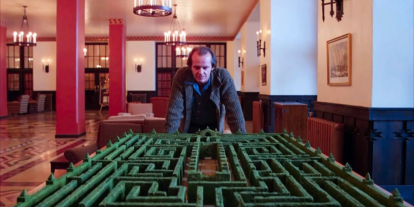 Jack (Jack Nicholson) looks at a replica of the maze from The Shining  Image