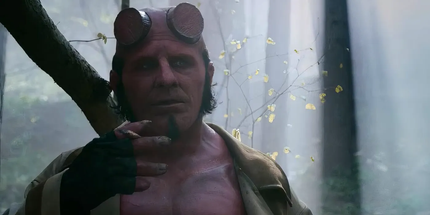 Jack Kesy as Hellboy smoking a blunt in the woods in Hellboy The Crooked Man Image