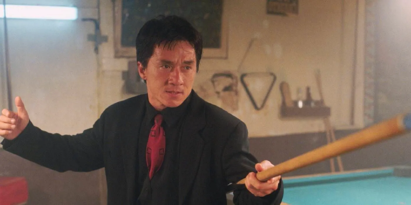 Jackie Chan holding a pool stick in Rush Hour. Image