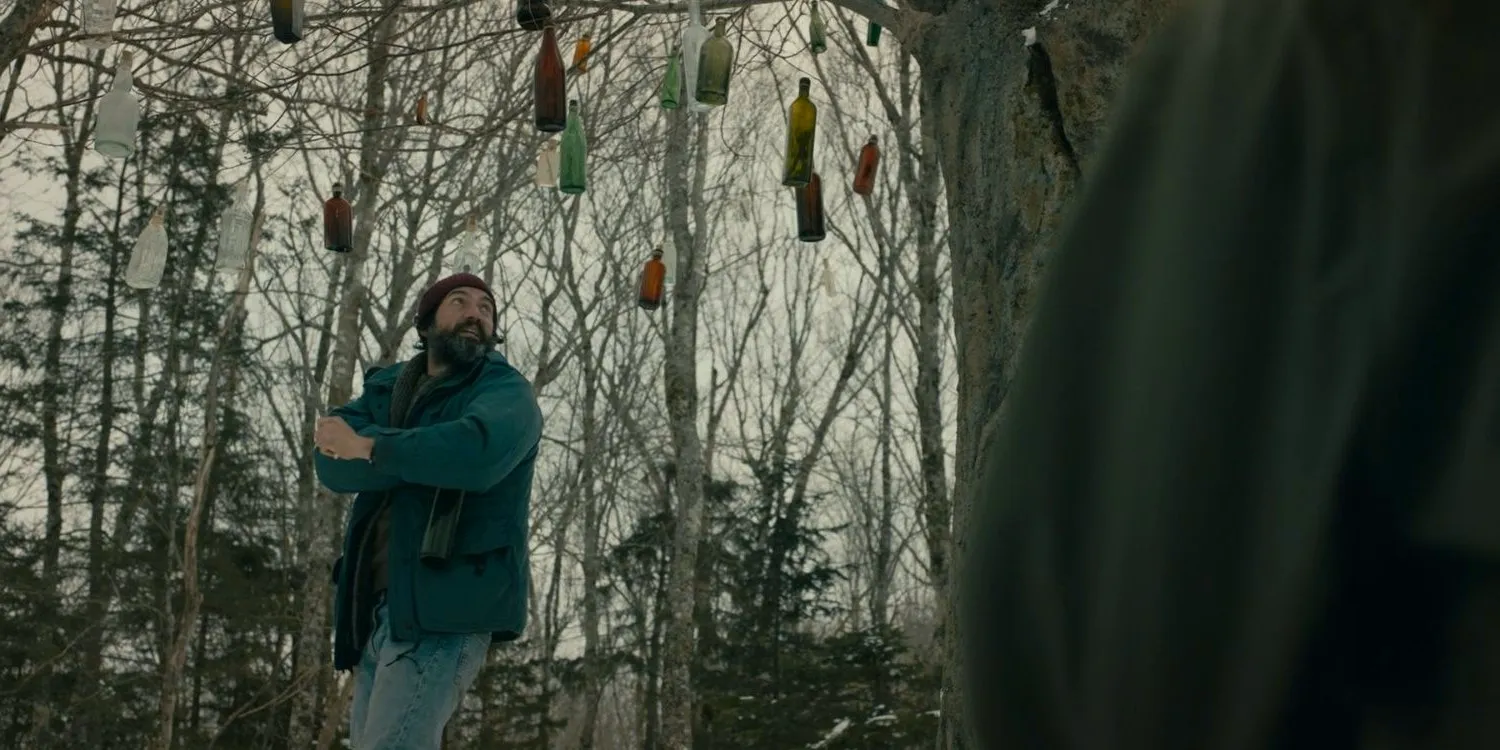 Jade looking up at the bottle tree in From season 3, episode 5 Image