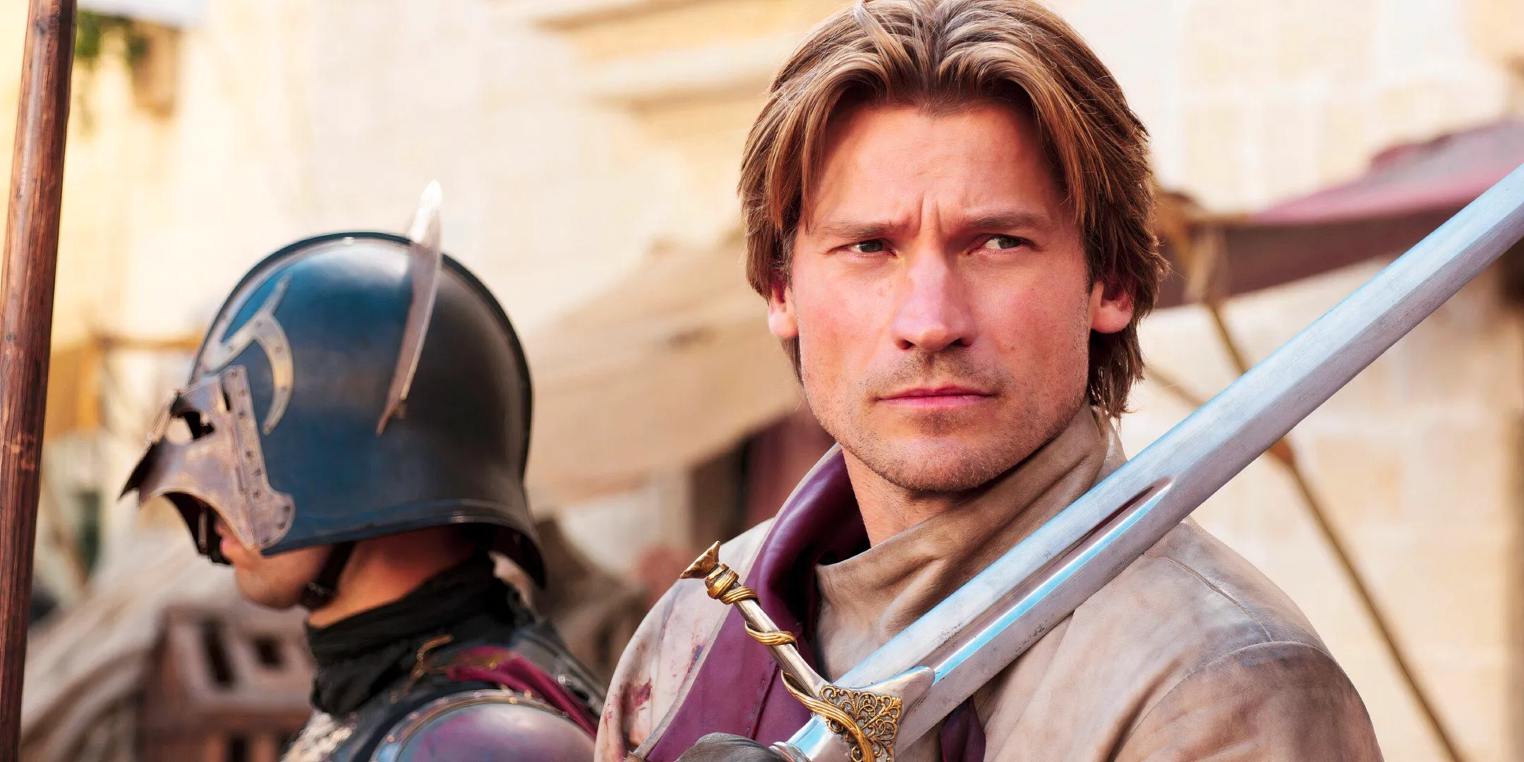 Jaime Lannister (Nikolaj Coster-Waldau) holding a sword in Game of Thrones season 1 Image