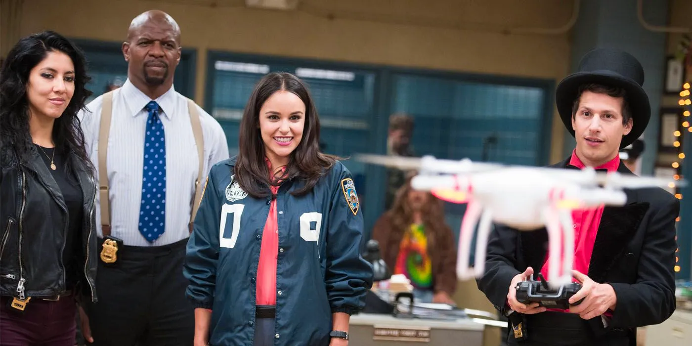 Jake flies a drone as Amy, Terry, and Rosa look on in Brooklyn Nine Nine Image