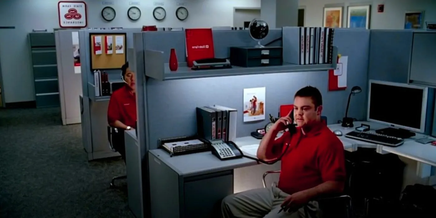 Jake Stone on the phone in an office in the original State Farm commercial Image