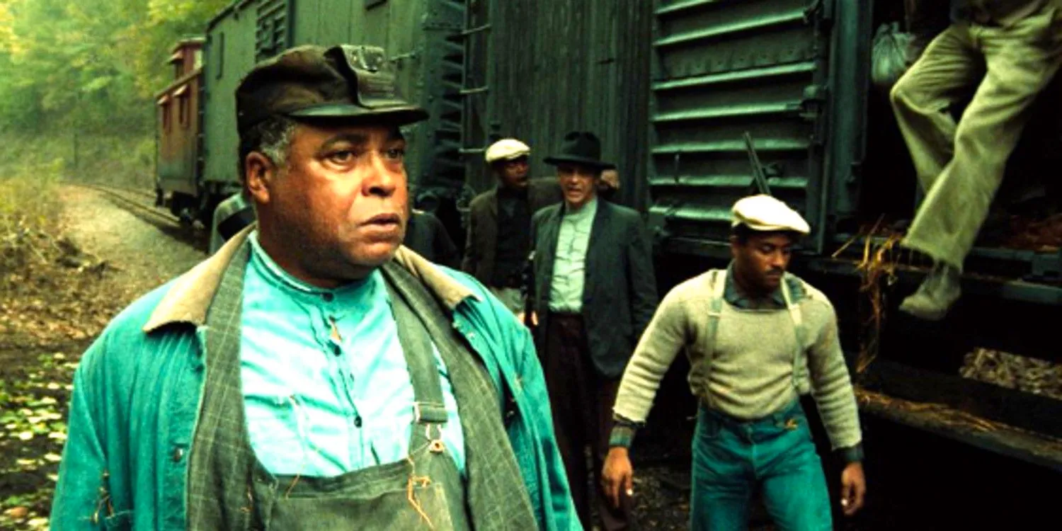 James Earl Jones in Matewan standing outside a railcar. Image