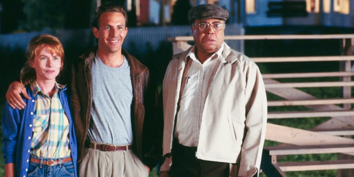 James Earl Jones, Kevin Costner, and Amy Madigan with their arms around each other in Field of Dreams. Image