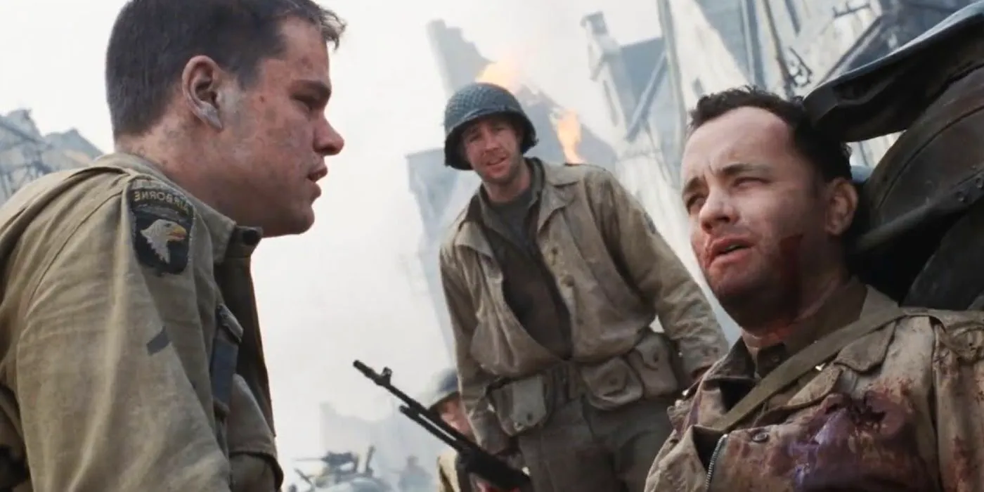 James Ryan (Matt Damon) looking at a bloody and injured Captain Miller (Tom Hanks) in Saving Private Ryan  Image