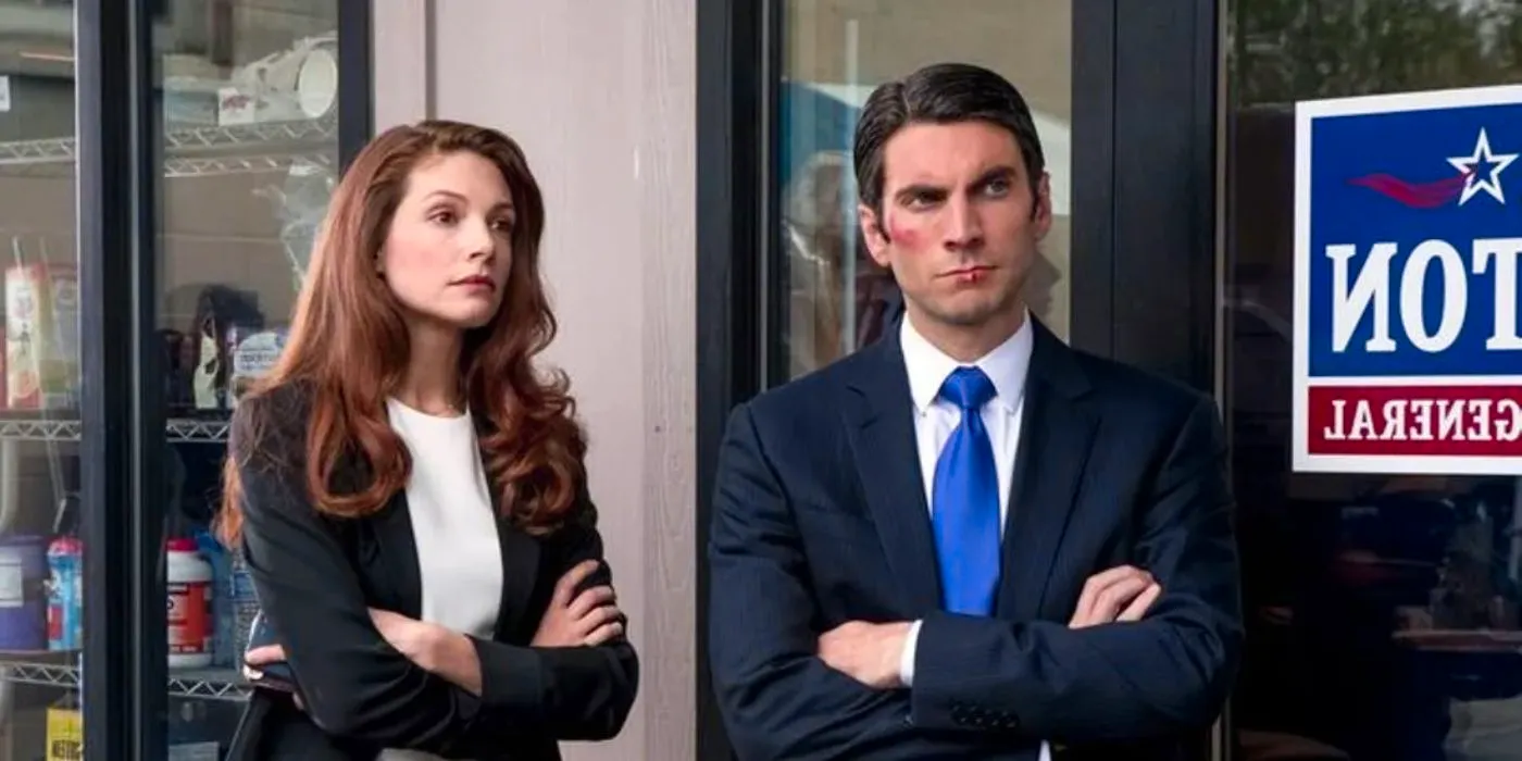 Jamie Dutton (Wes Bentley) and Christina (Katherine Cunningham) standing together outside Jamie's office in Yellowstone. Image