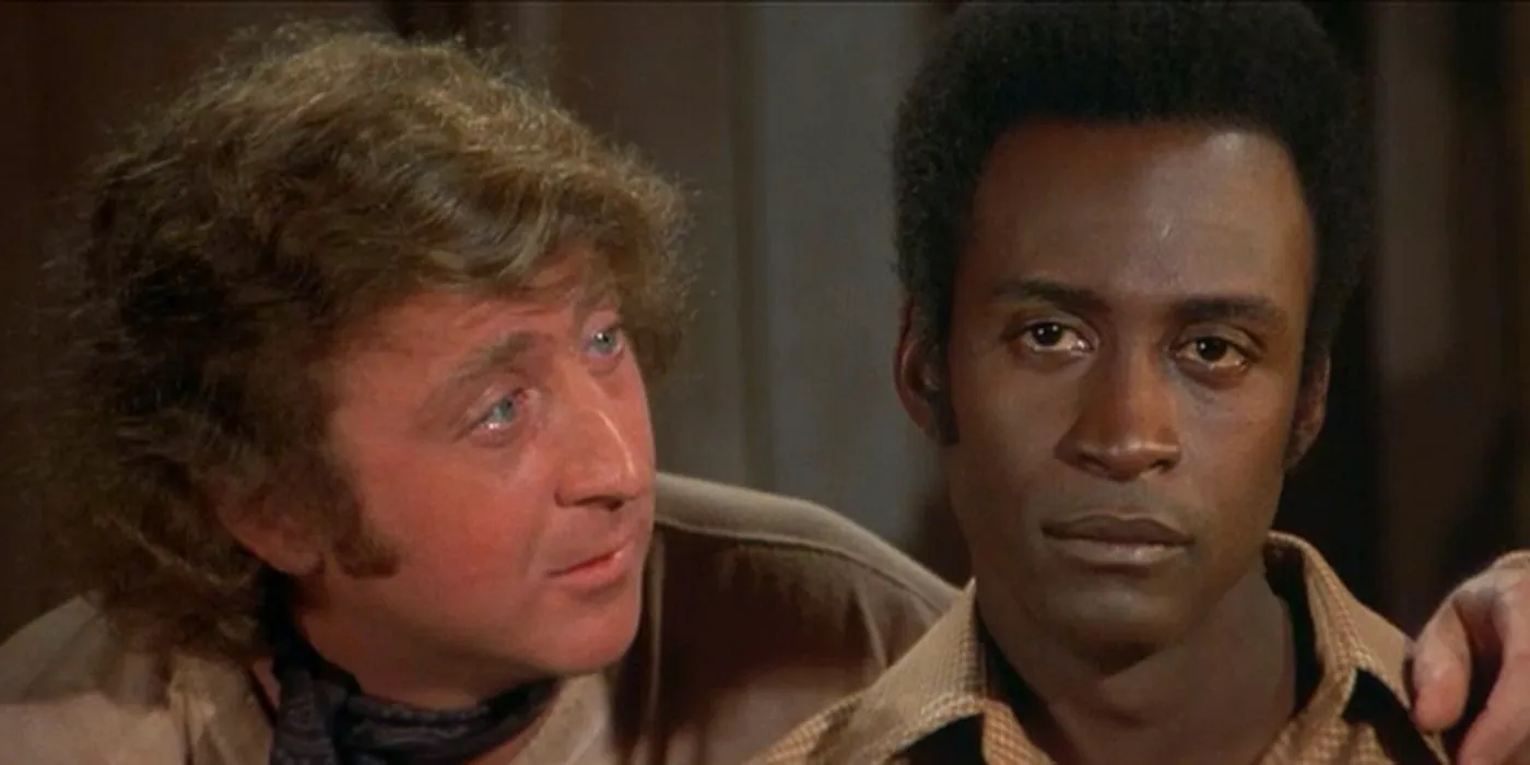 Jan (Gene Wilder) and Bart (Cleavon Little) in a police station talking to one another in Blazing Saddles Image