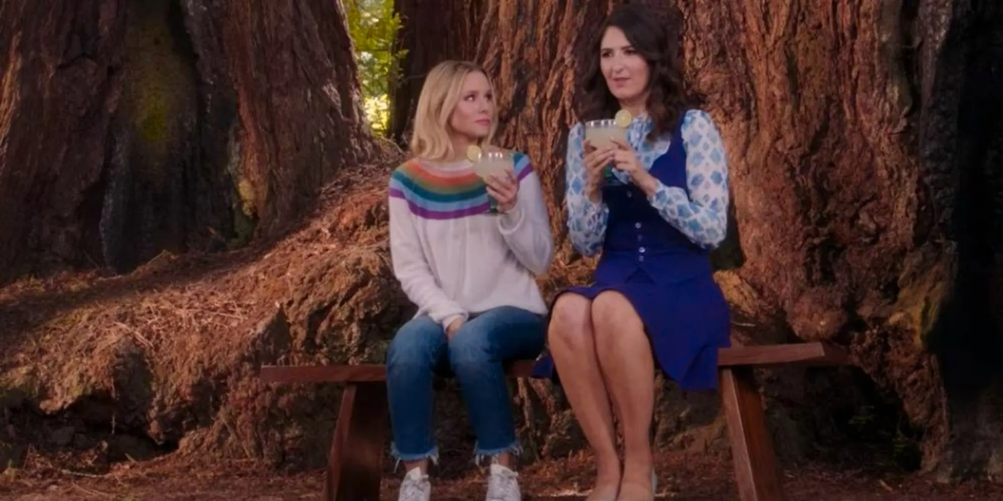 Janet and Eleanor have a drink by a tree in The Good Place (1) Image