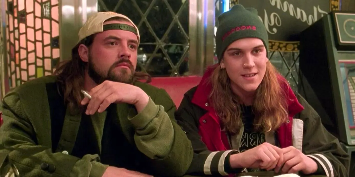 Jason Mewes and Kevin Smith as Jay and Silent Bob talk and smoke at a diner in Dogma Image