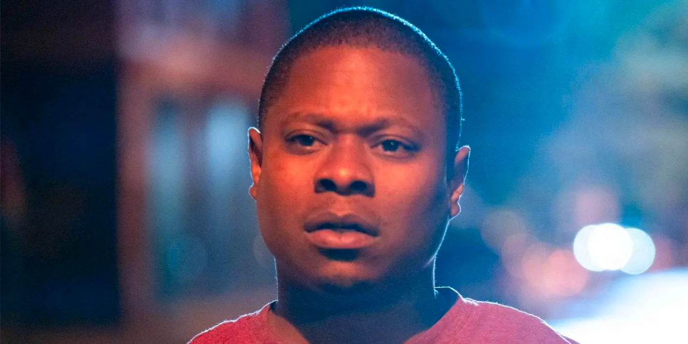 Jason Mitchell as Brandon on a city street looking scared in The Chi Image