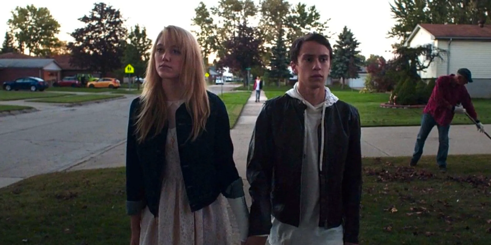 Jay and Paul walking together at the end of It Follows Image