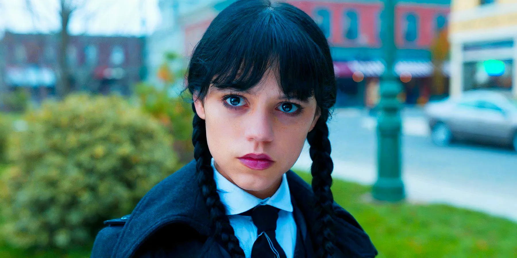 Jenna Ortega as Wednesday Addams giving a stern stare at someone in Wednesday season 1 Image