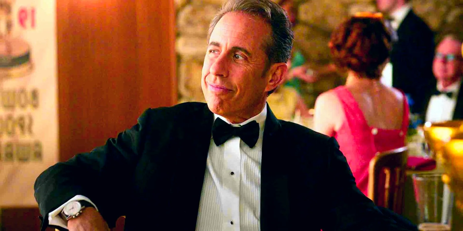 Jerry Seinfeld wearing a tux and looking smug in Unfrosted Image