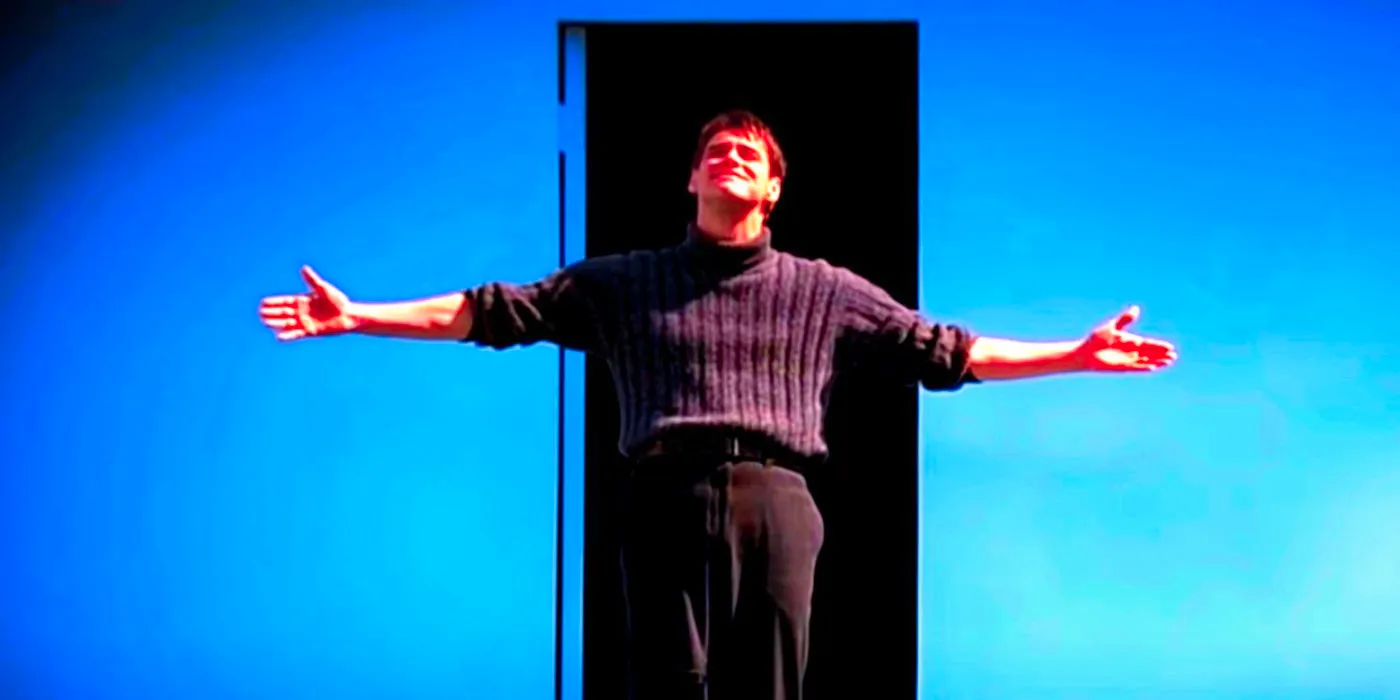 Jim Carrey standing with his arms wide open in The Truman Show Image