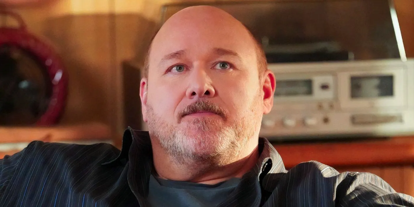 Jim McAllister (Will Sasso) looks up sternly in Young Sheldon Image