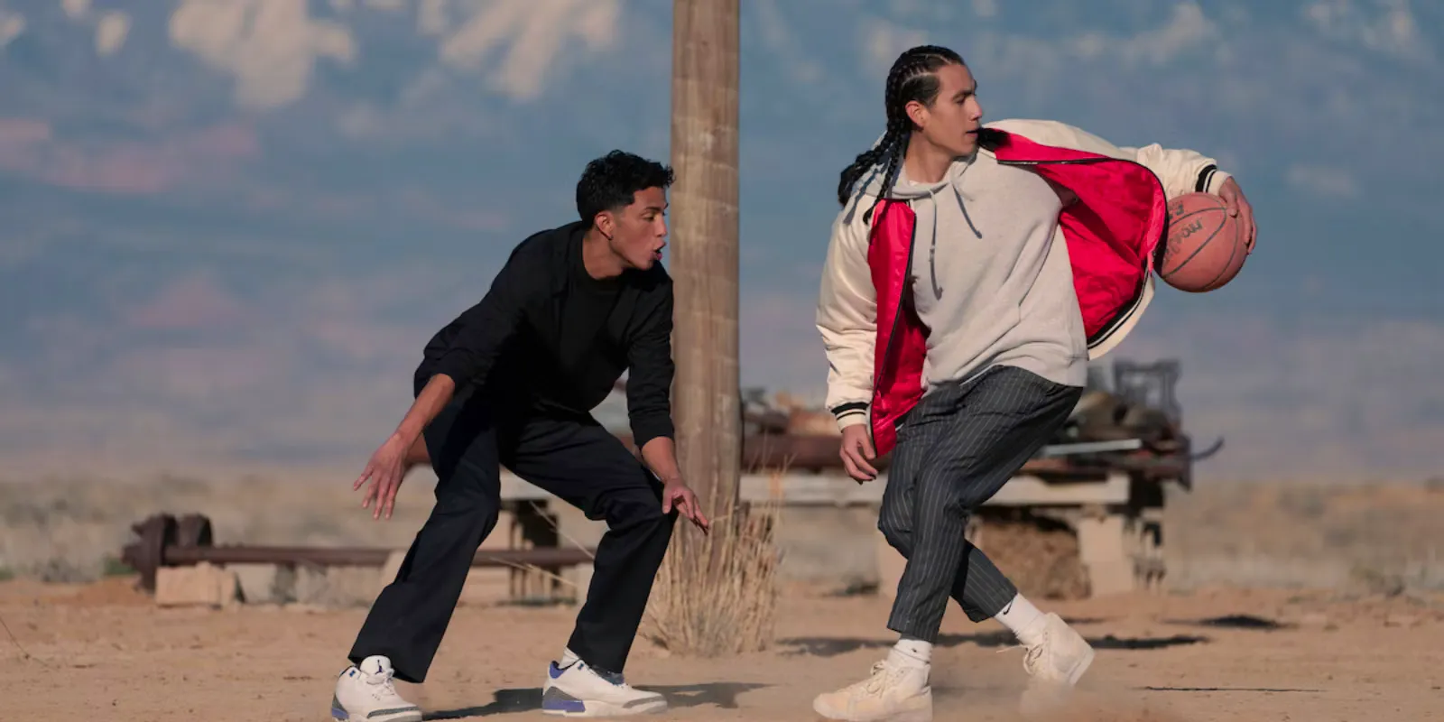 Jimmy and Nataanii playing basketball in Rez Ball Image